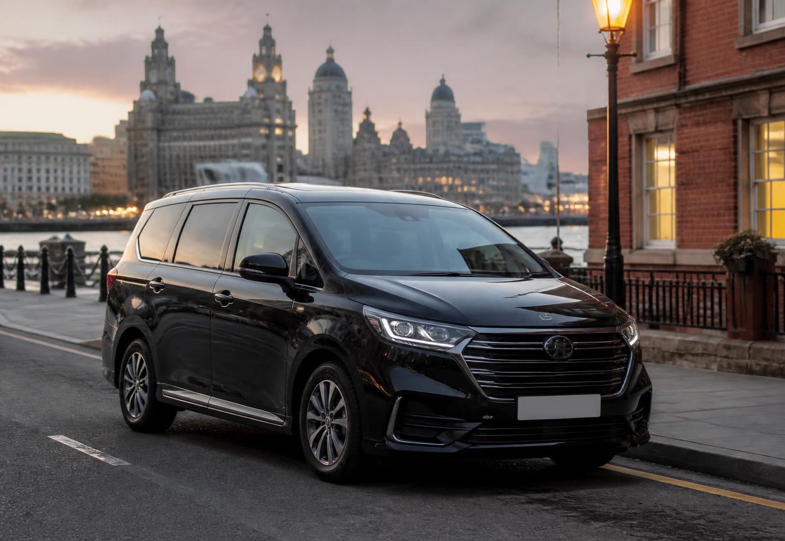 Black people carrier parked on a Liverpool waterfront street at dusk